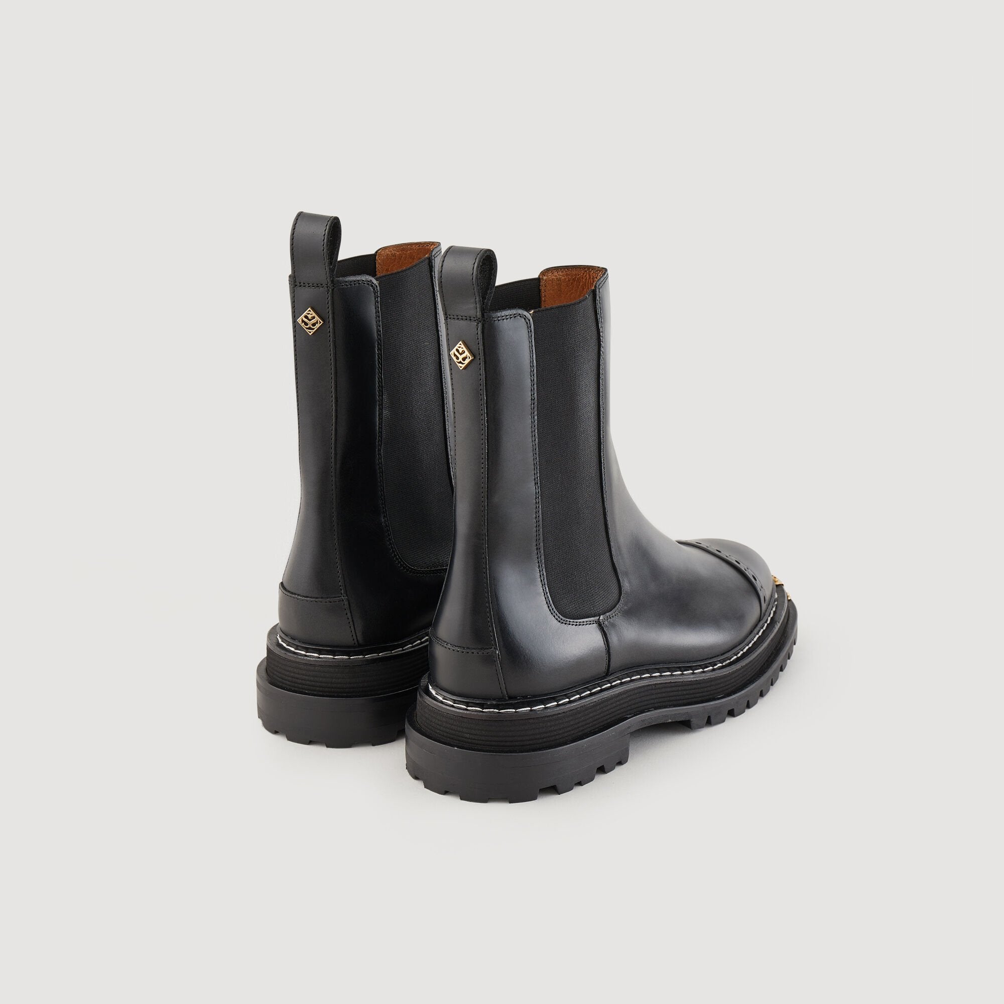 Ankle boots with notched sole Black Sandro Women
