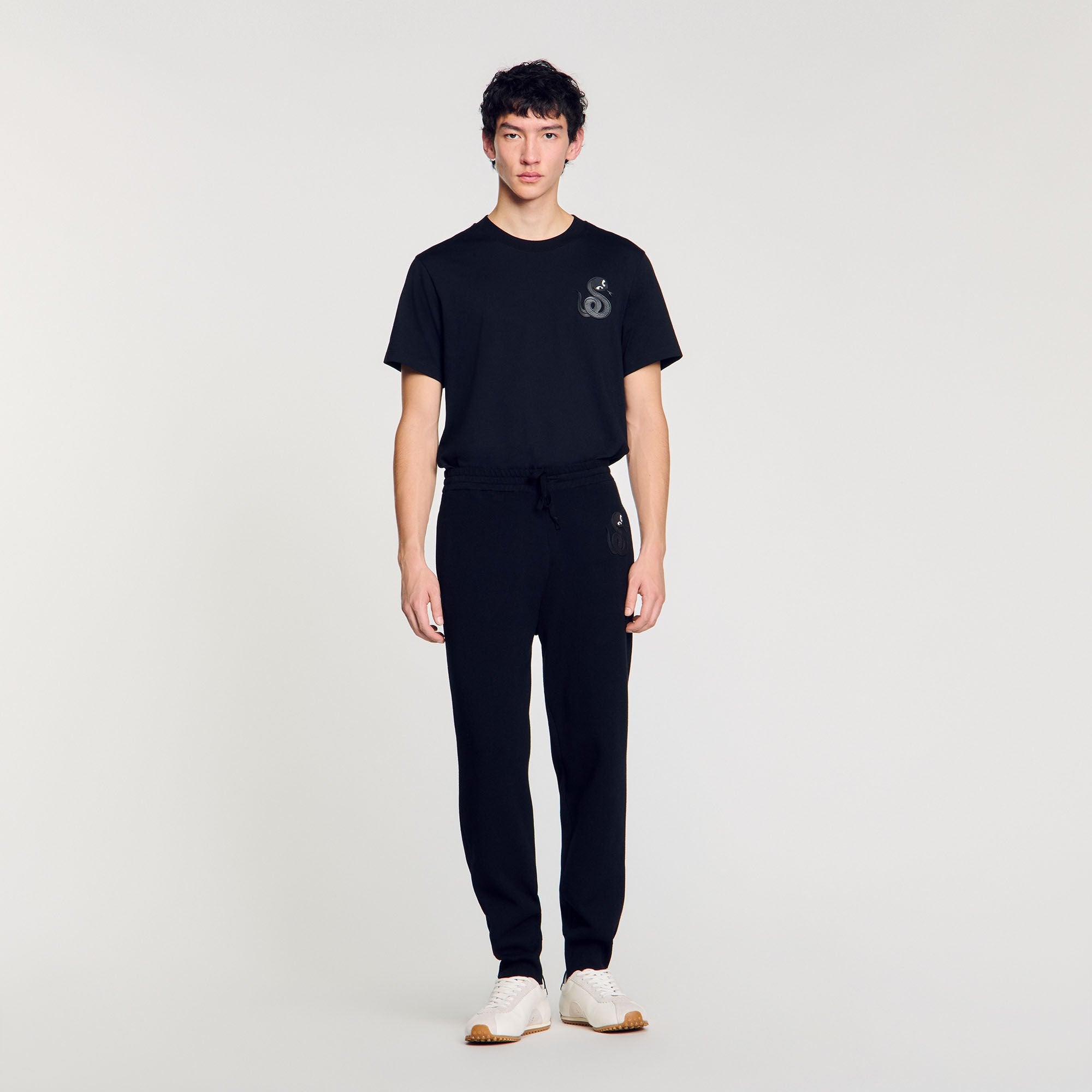 Joggers with snake detail Black Sandro Men
