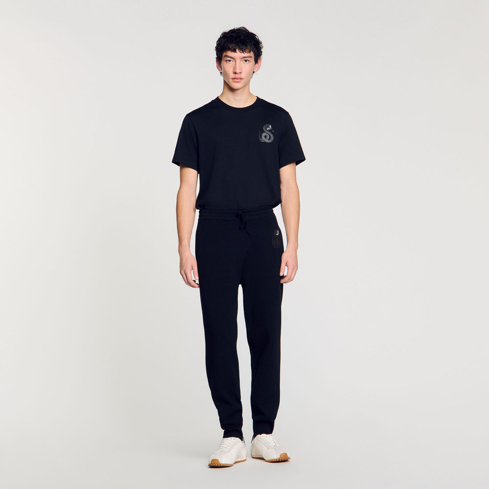 Joggers with snake detail Black Sandro Men