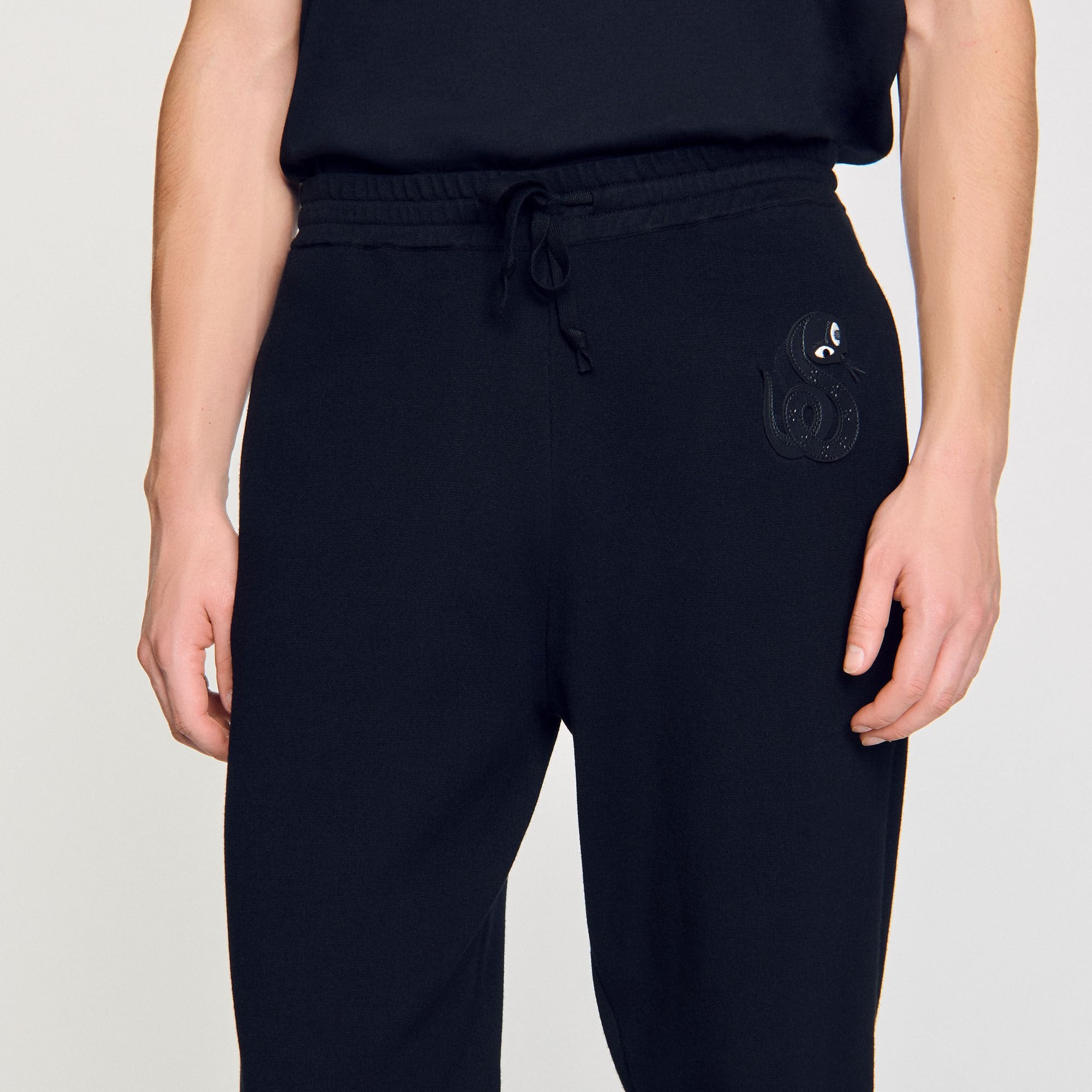 Joggers with snake detail Black Sandro Men
