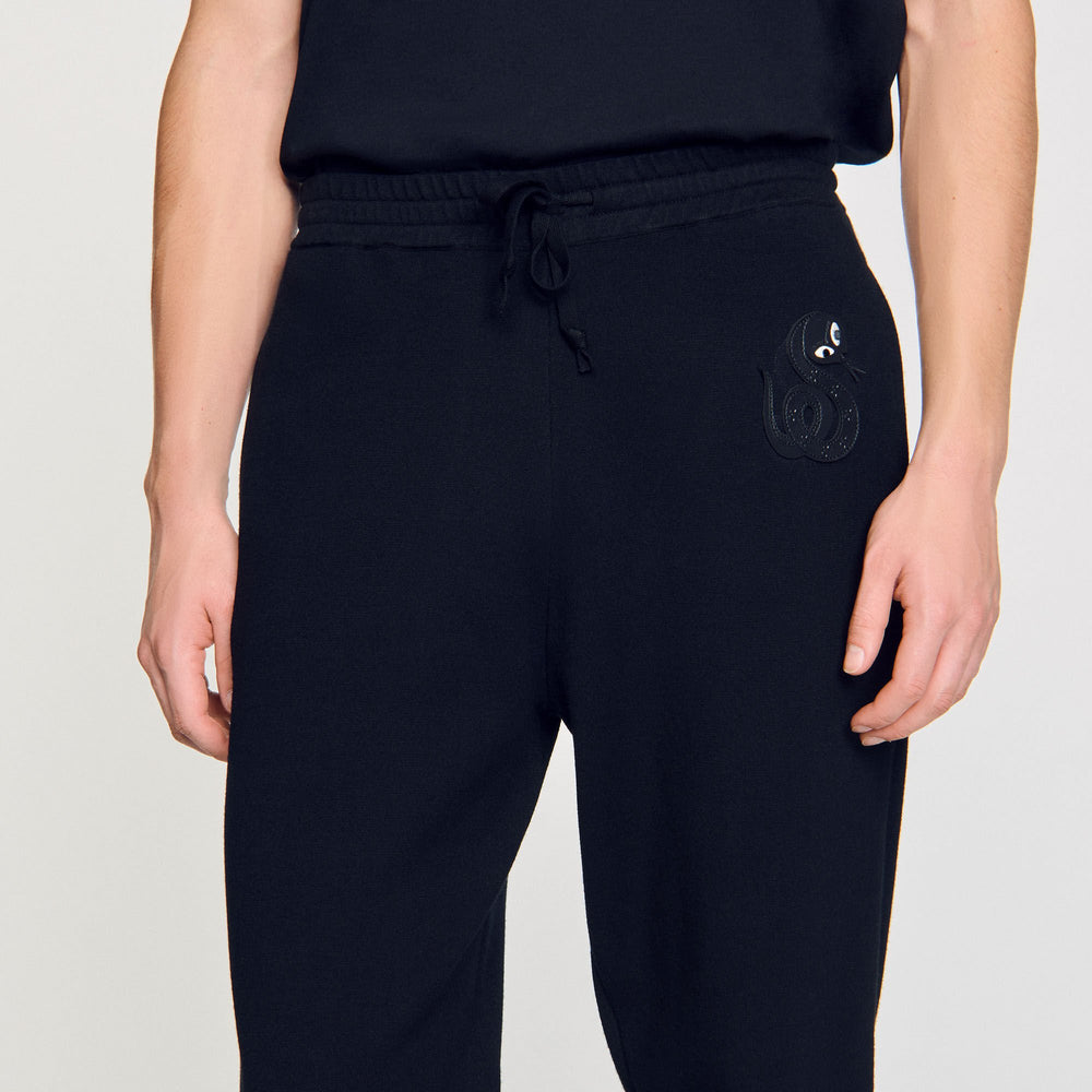 Joggers with snake detail Black Sandro Men