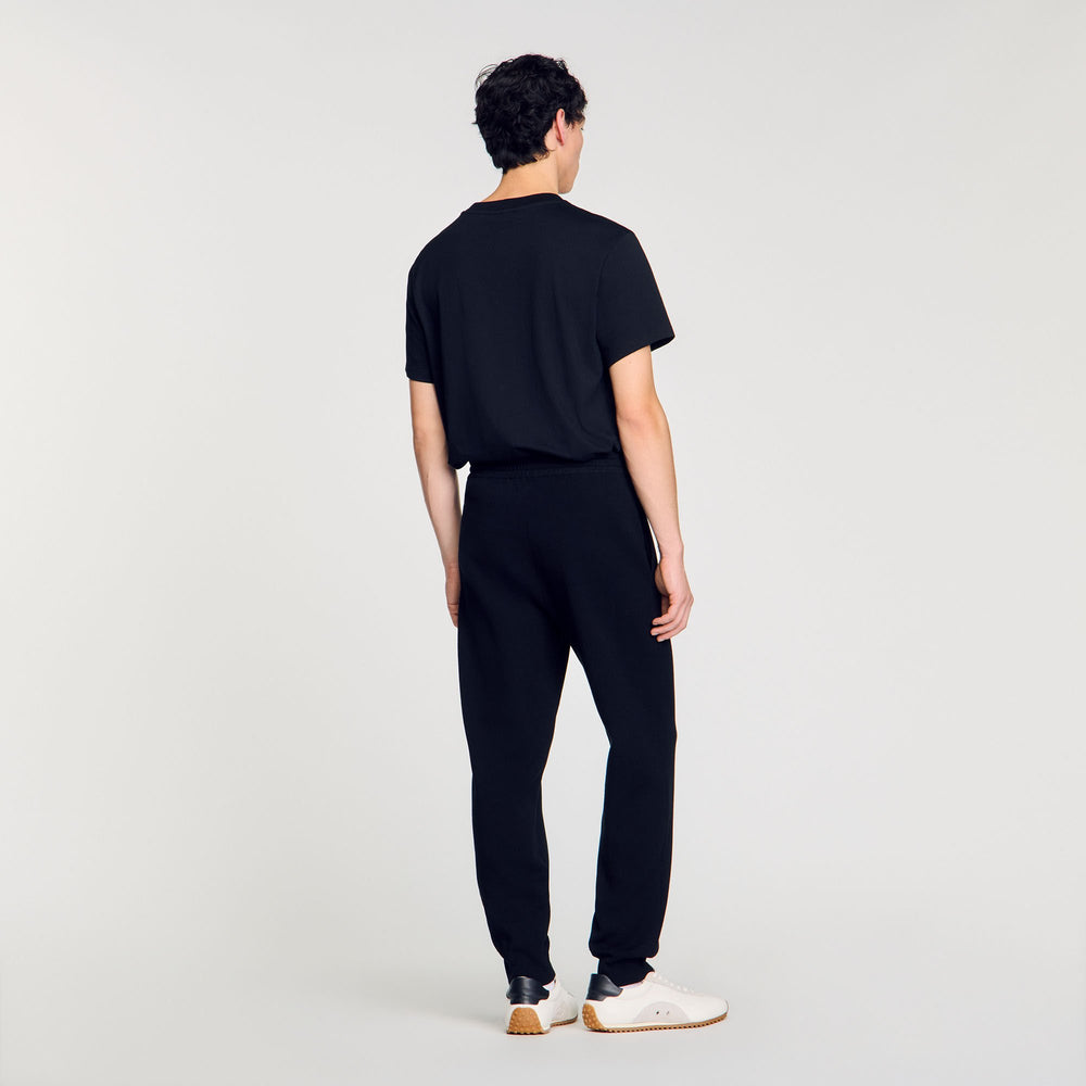 Joggers with snake detail Black Sandro Men