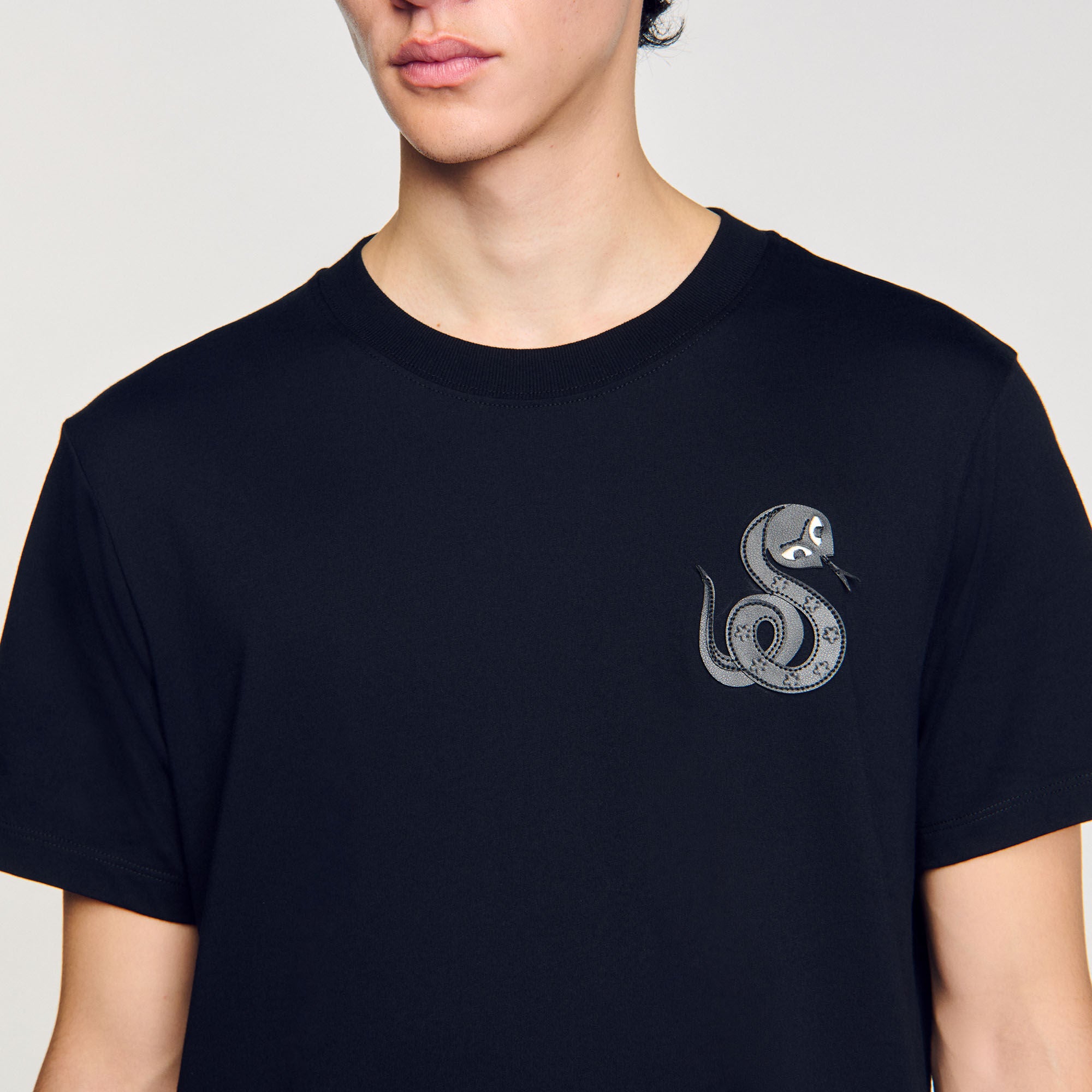 T-shirt with snake detail Black Sandro Men