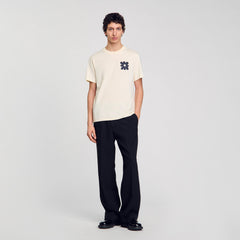 T-shirt with flower detail Ivory. Sandro Men