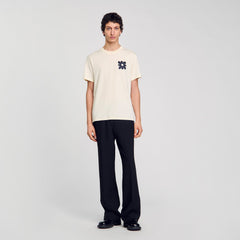 T-shirt with flower detail Ivory. Sandro Men