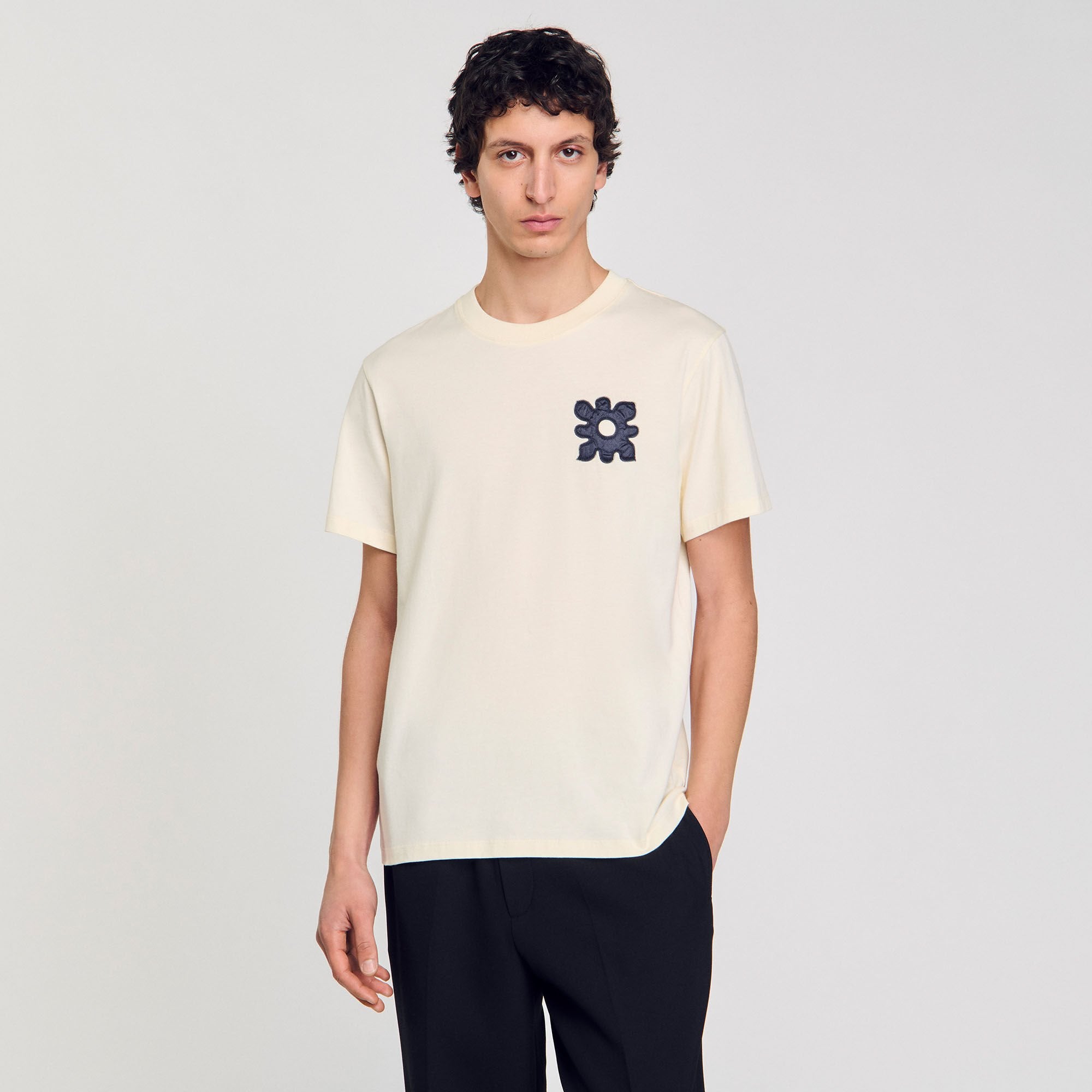 T-shirt with flower detail Ivory. Sandro Men