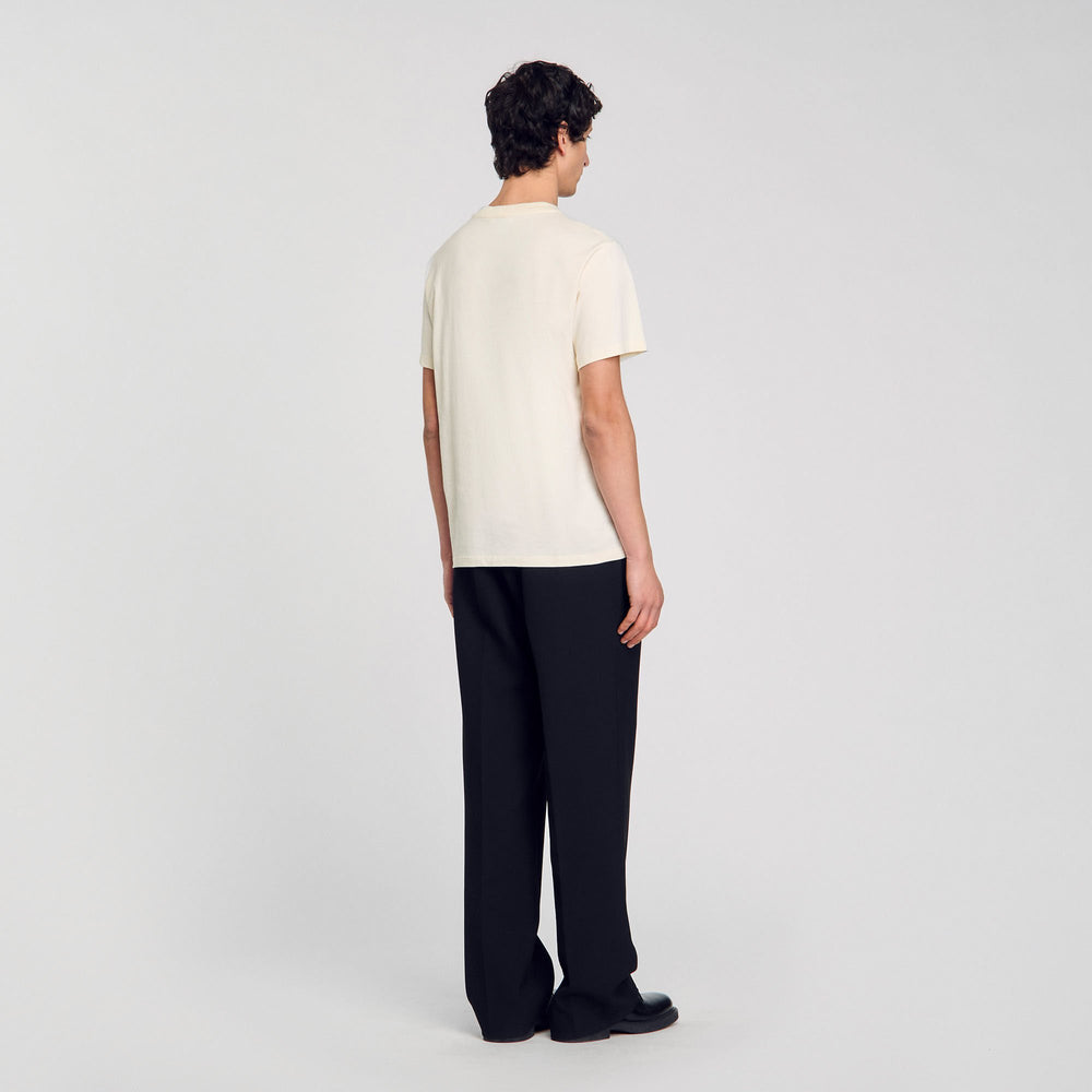T-shirt with flower detail Ivory. Sandro Men
